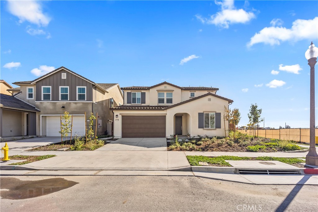 16717 Dara Avenue Chino, CA 91708 - Photo 2 of 41 a front view of a house with a yard