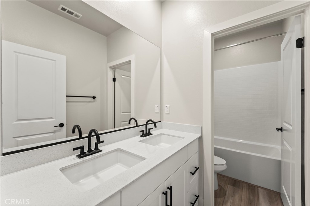 16717 Dara Avenue Chino, CA 91708 - Photo 23 of 41 a bathroom with a sink and a mirror