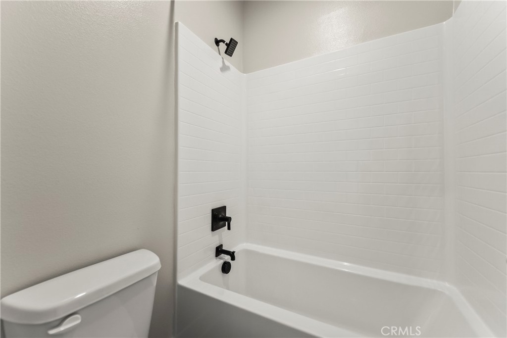 16717 Dara Avenue Chino, CA 91708 - Photo 24 of 41 a view of a bathroom with a tub and toilet