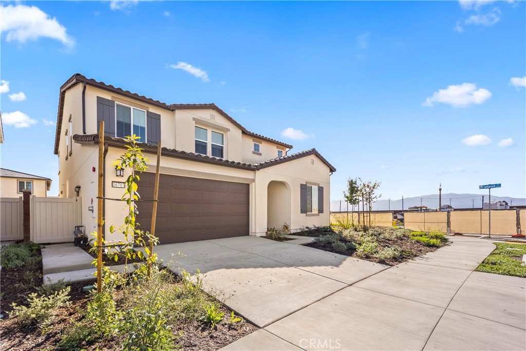 16717 Dara Avenue Chino, CA 91708 - Photo 3 of 41 a front view of a house with a yard