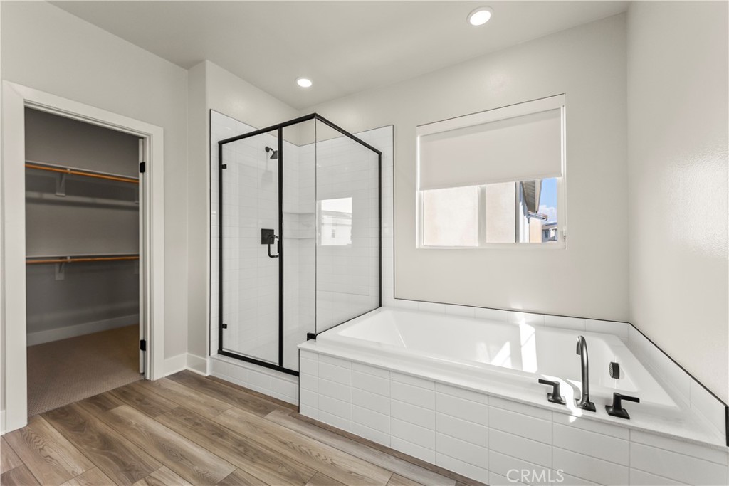 16717 Dara Avenue Chino, CA 91708 - Photo 31 of 41 a bathroom with a bathtub and a shower