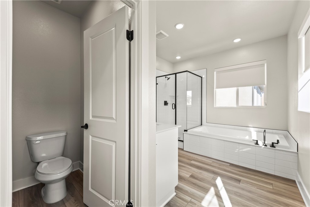 16717 Dara Avenue Chino, CA 91708 - Photo 35 of 41 a bathroom with a bathtub shower sink and toilet