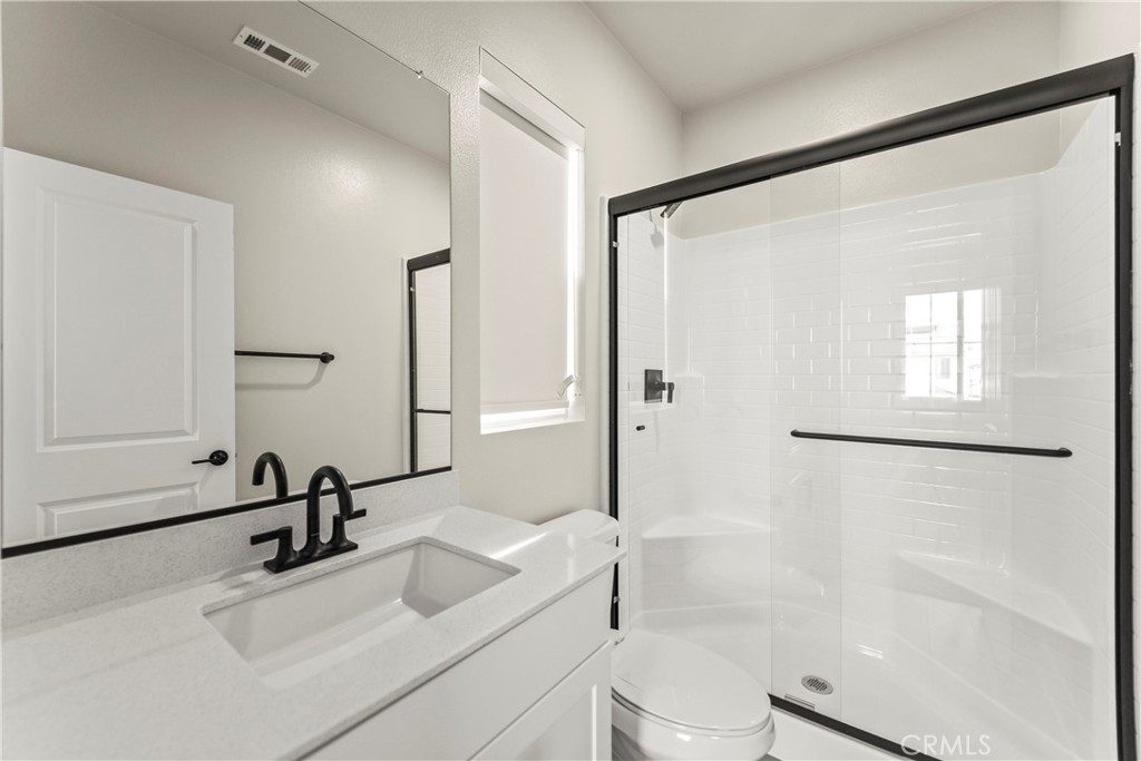 16717 Dara Avenue Chino, CA 91708 - Photo 38 of 41 a bathroom with a sink mirror toilet and bathtub