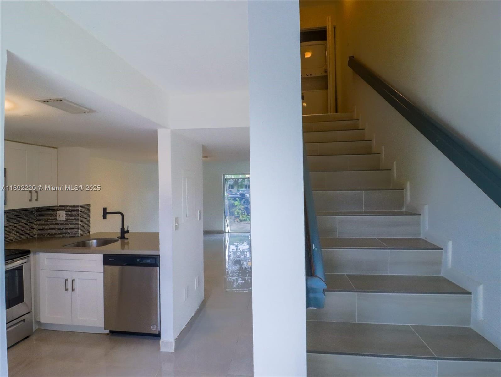14010 Northeast 3rd Court, Unit 1 Miami, FL 33161 - Photo 20 of 26 a view of entryway and kitchen