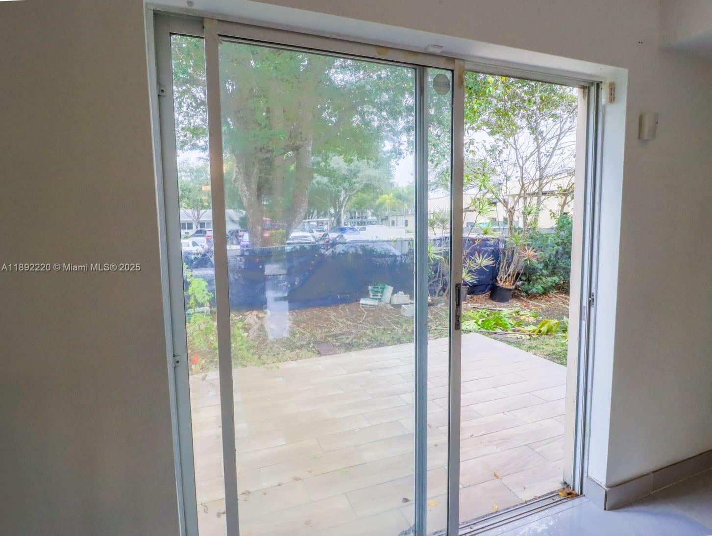 14010 Northeast 3rd Court, Unit 1 Miami, FL 33161 - Photo 21 of 26 a bathroom with a glass door