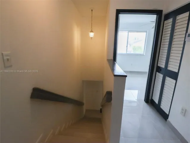 a view of hallway with stairs