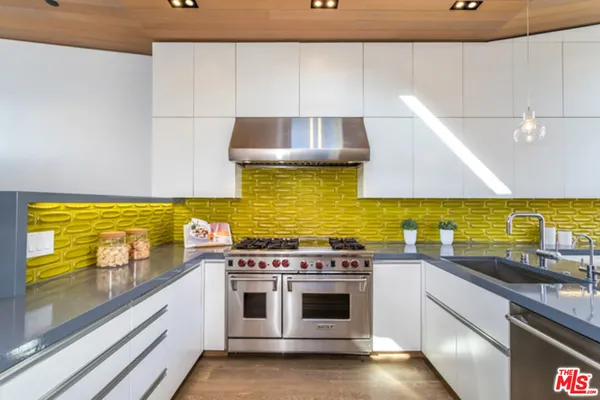 a kitchen with a stove and a sink