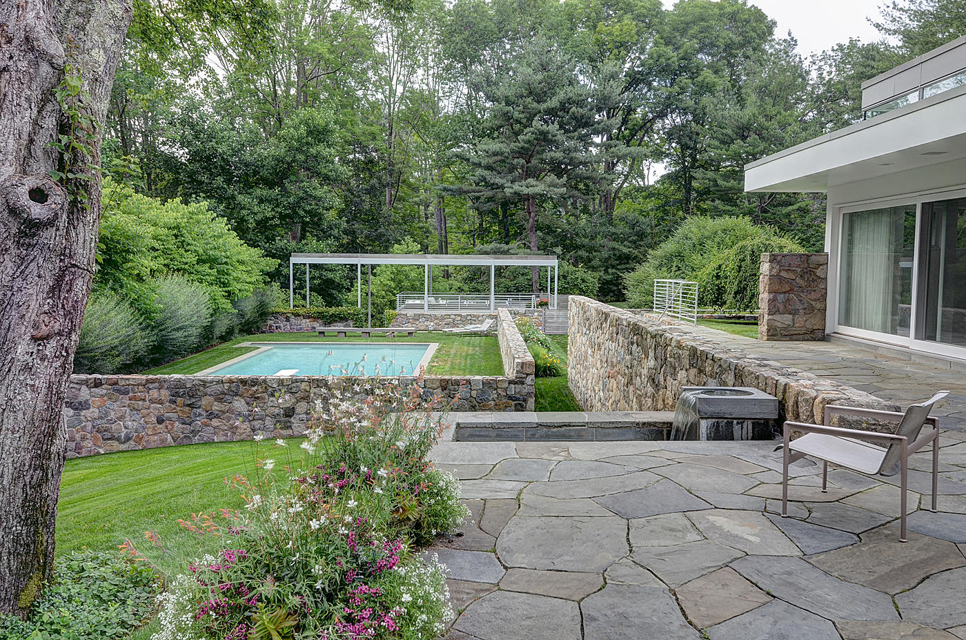 628 West Road New Canaan, CT 06840 - Photo 26 of 28 a view of a backyard with furniture