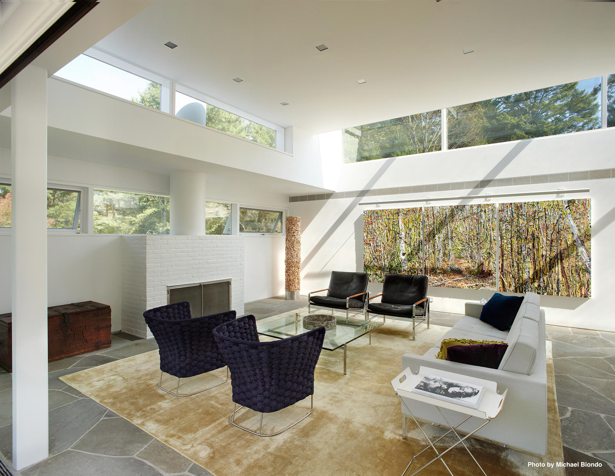 628 West Road New Canaan, CT 06840 - Photo 4 of 28 a living room with furniture a large window and a table