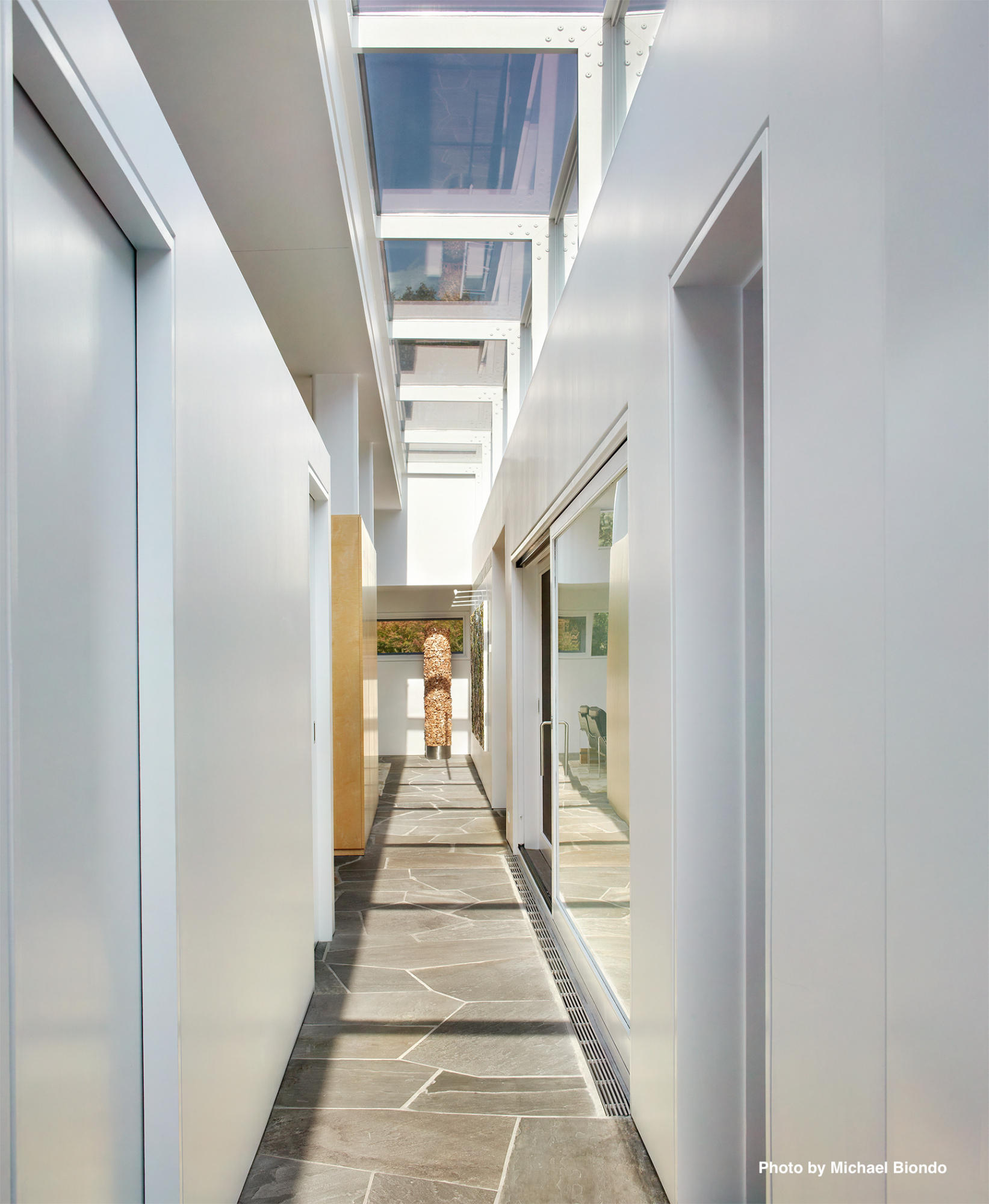 628 West Road New Canaan, CT 06840 - Photo 9 of 28 a hallway with stairs and a white door