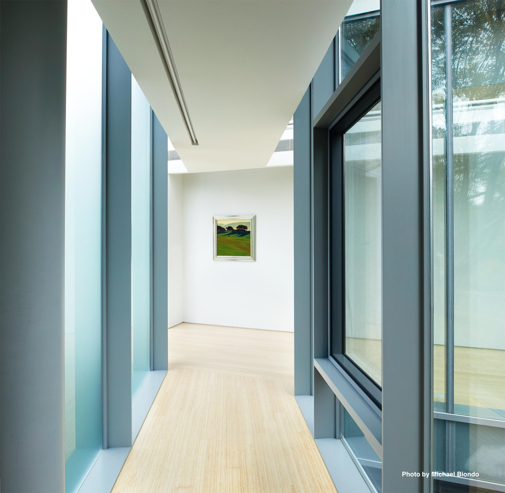 628 West Road New Canaan, CT 06840 - Photo 10 of 28 a view of a hallway with wooden floor and a bathroom