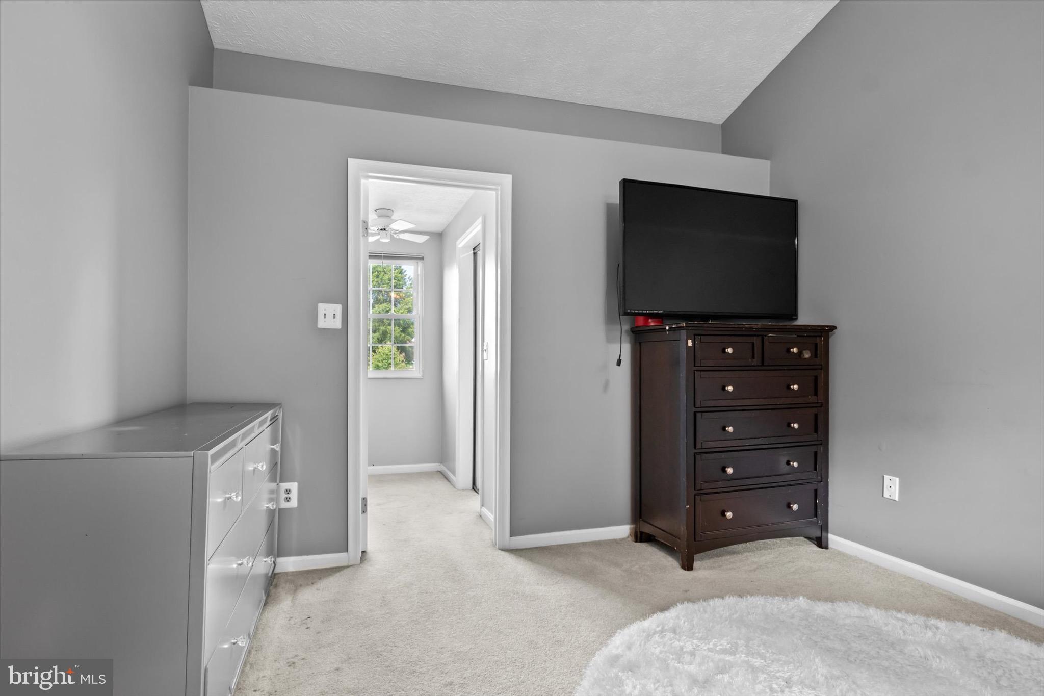 10462 Brackets Ford Circle Manassas, VA 20110 - Photo 16 of 39 a living room with furniture and a flat screen tv
