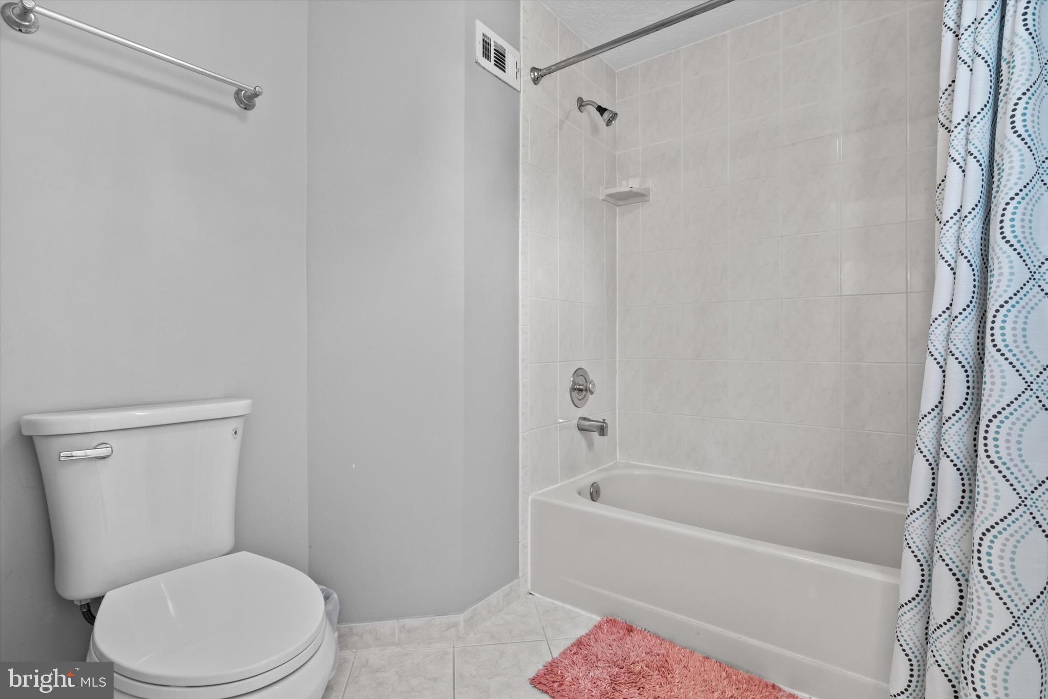 10462 Brackets Ford Circle Manassas, VA 20110 - Photo 18 of 39 a white toilet and tub sitting next to a bathroom sink