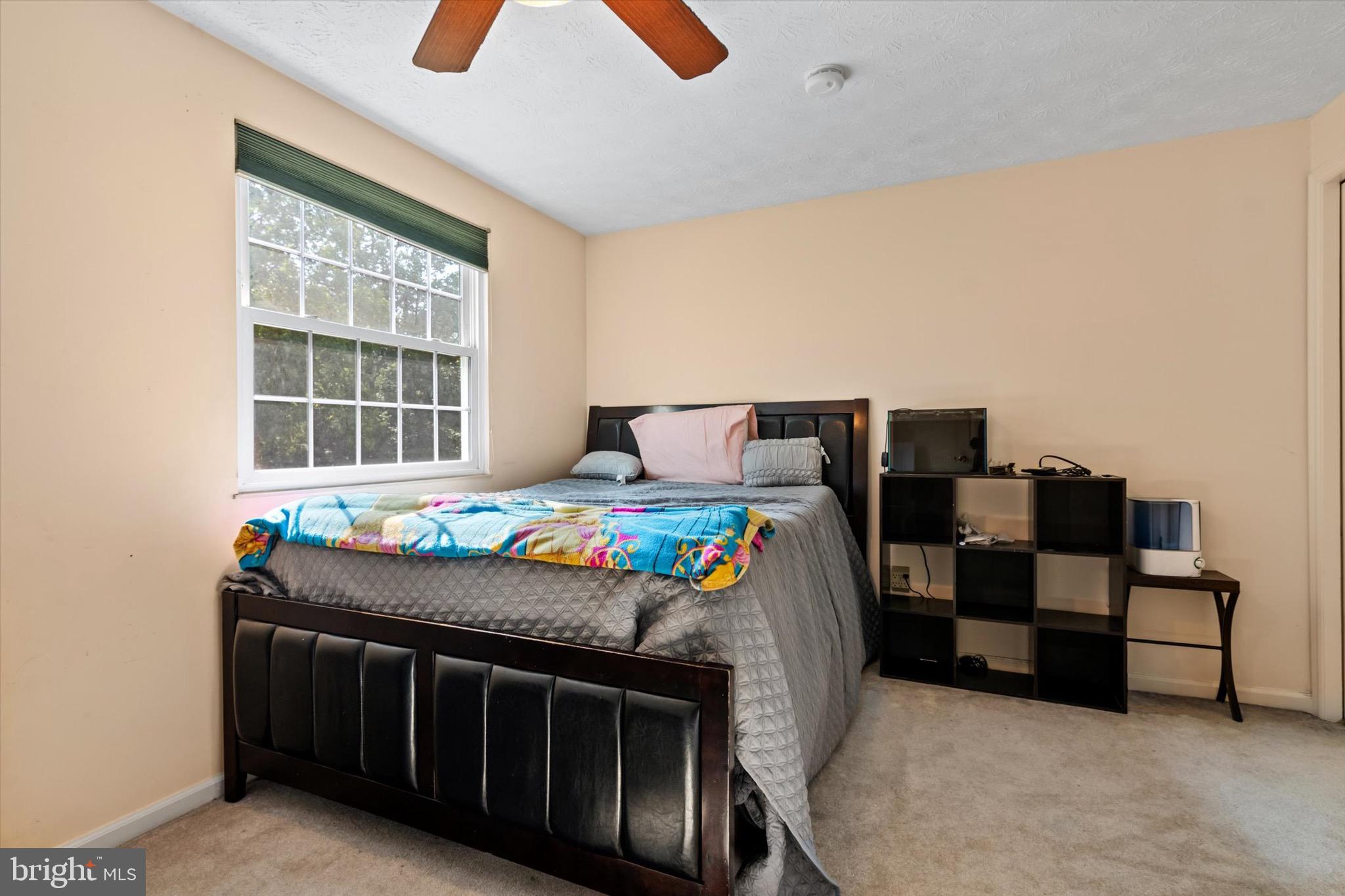 10462 Brackets Ford Circle Manassas, VA 20110 - Photo 21 of 39 a bedroom with furniture and a window