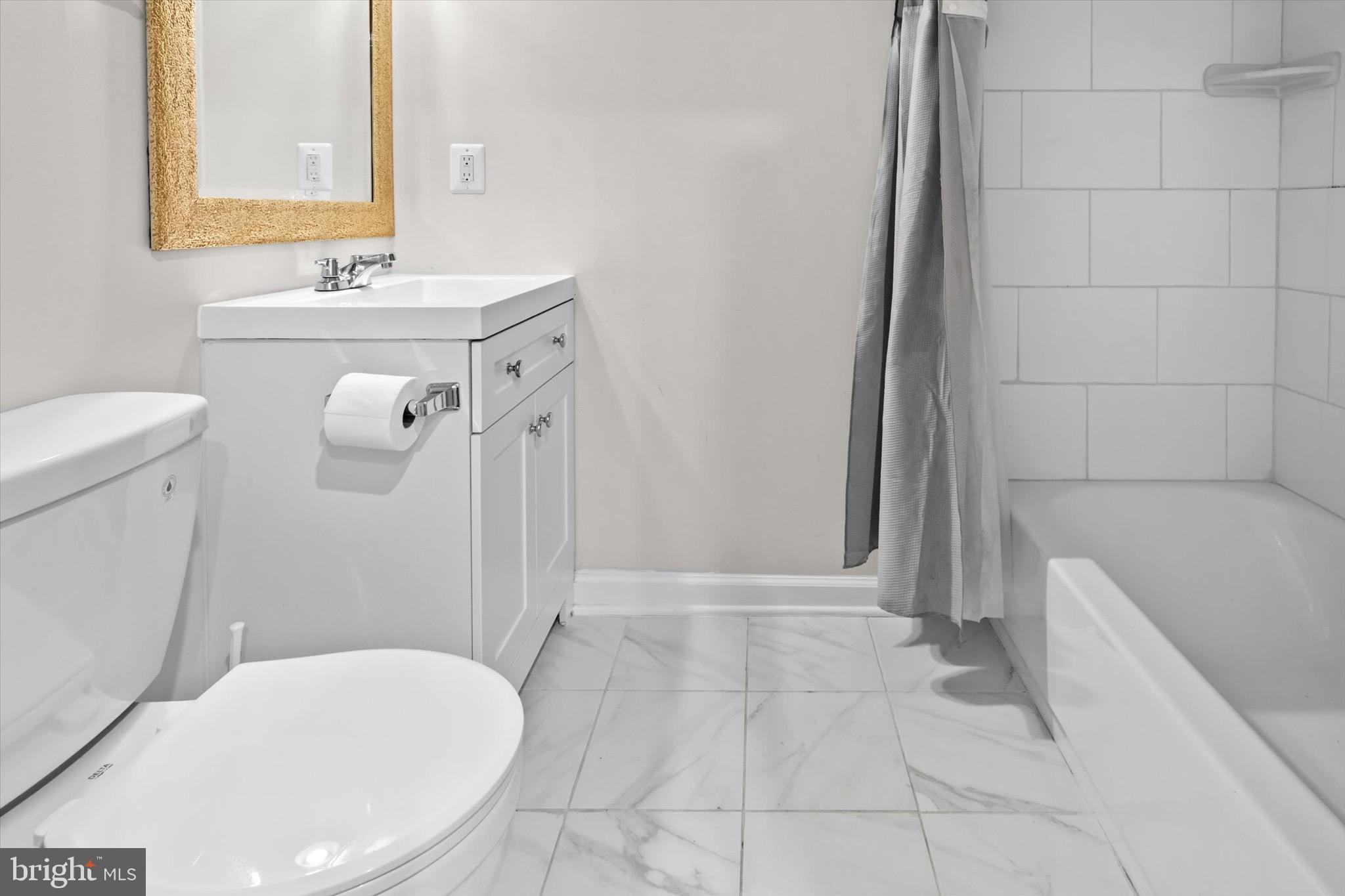 10462 Brackets Ford Circle Manassas, VA 20110 - Photo 27 of 39 a bathroom with a sink a toilet and shower