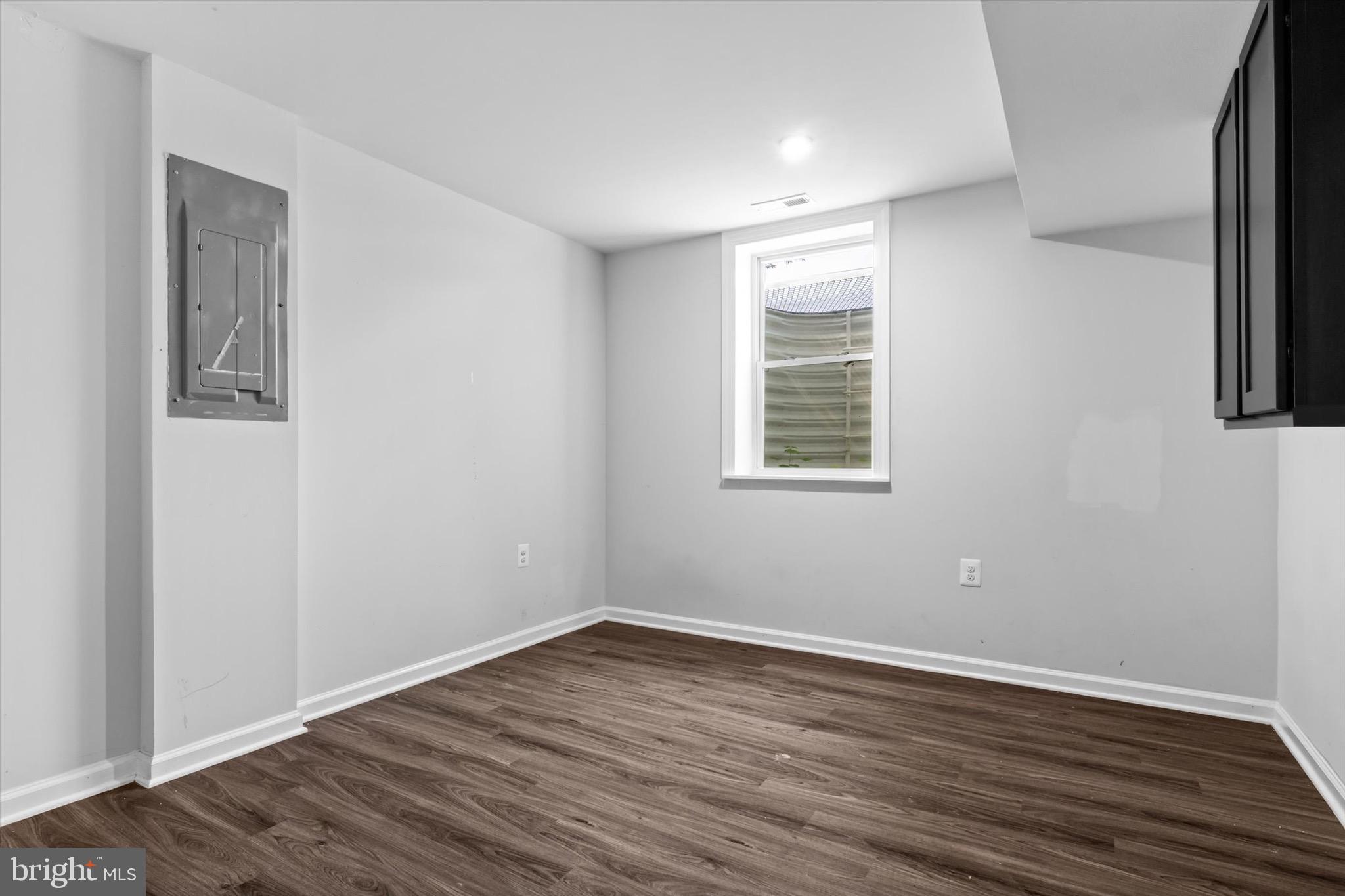 10462 Brackets Ford Circle Manassas, VA 20110 - Photo 29 of 39 a view of an empty room with wooden floor and a window