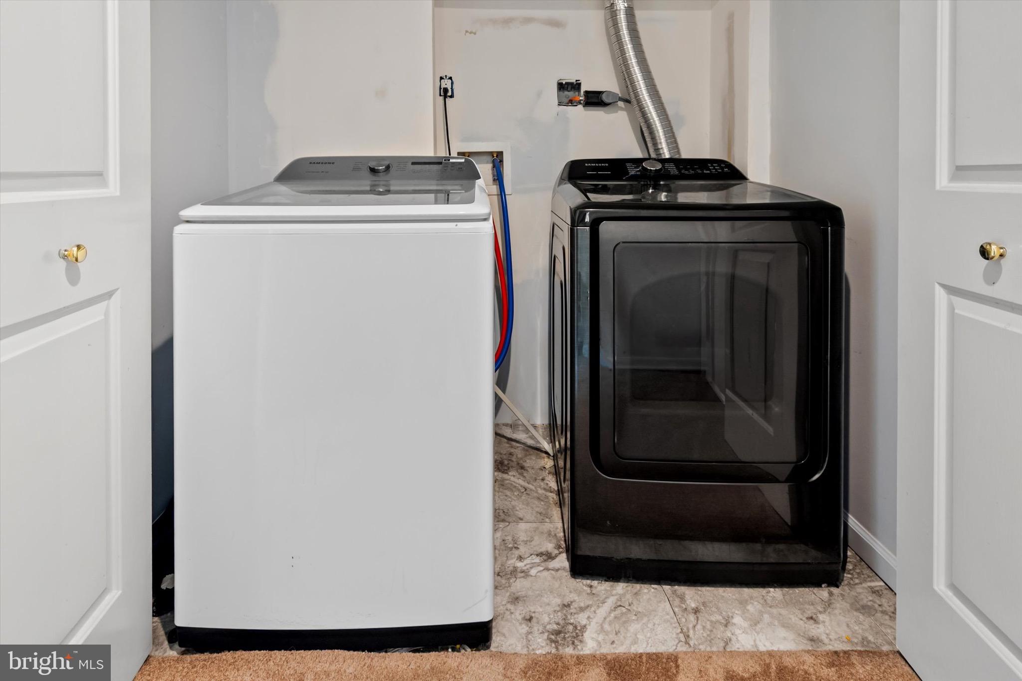 10462 Brackets Ford Circle Manassas, VA 20110 - Photo 32 of 39 a utility room with wooden floor washer and dryer