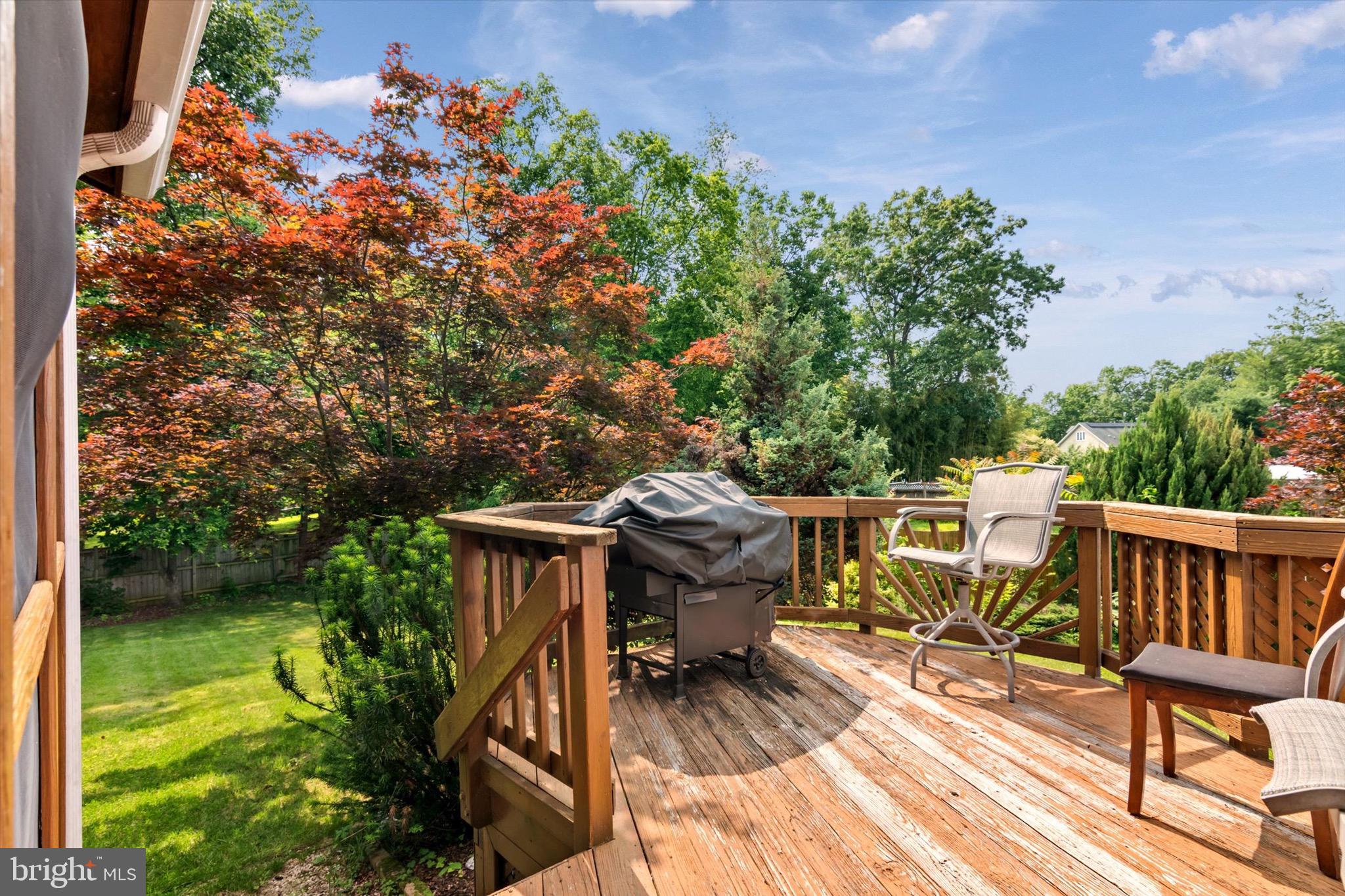 10462 Brackets Ford Circle Manassas, VA 20110 - Photo 35 of 39 a view of a patio with table and chairs with wooden floor and fence