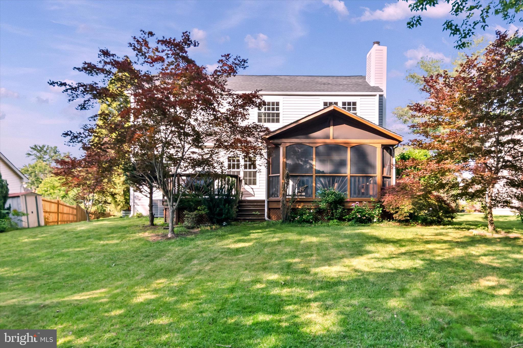 10462 Brackets Ford Circle Manassas, VA 20110 - Photo 36 of 39 a front view of a house with a garden