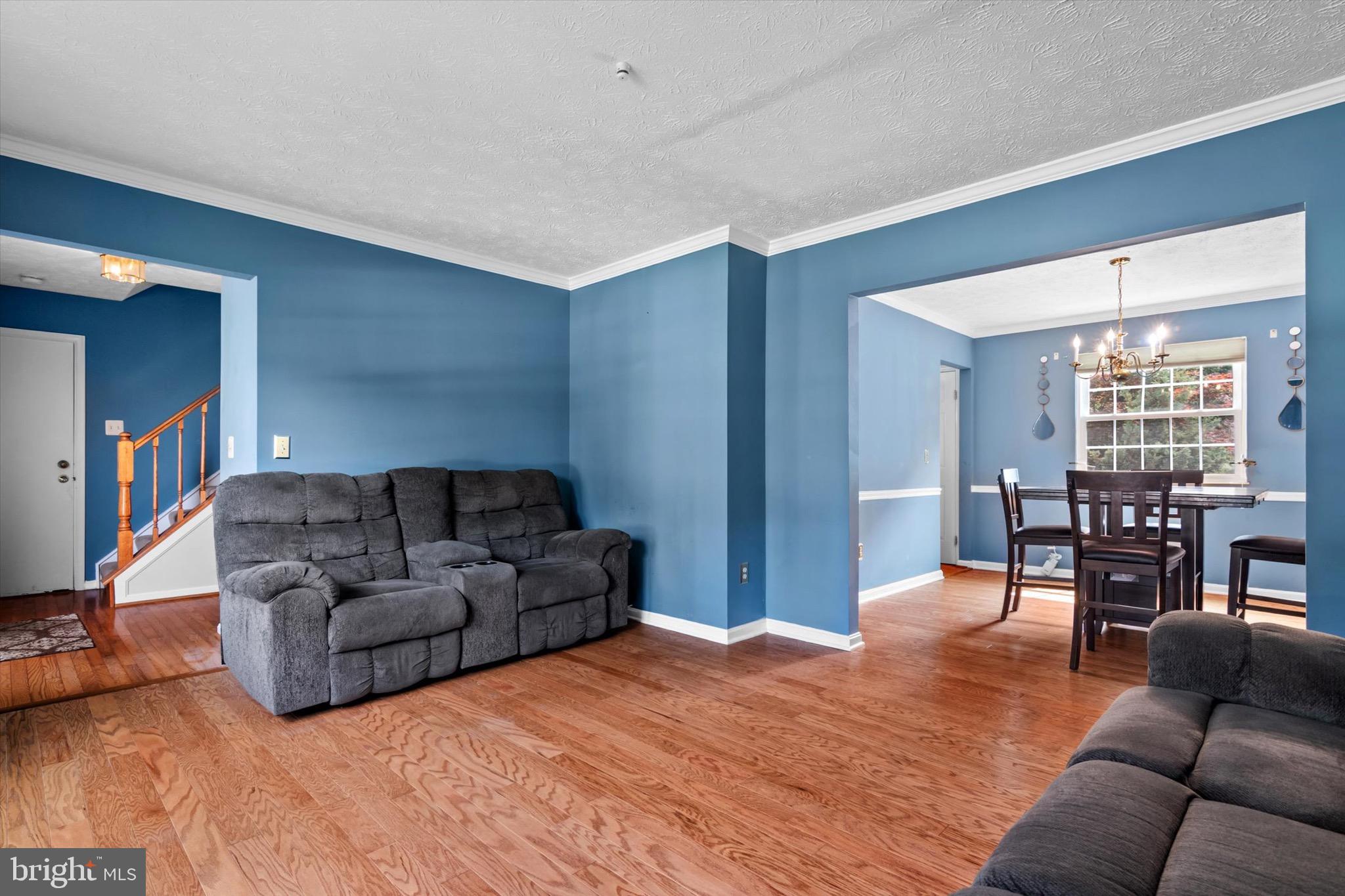 10462 Brackets Ford Circle Manassas, VA 20110 - Photo 6 of 39 a living room with furniture window and wooden floor