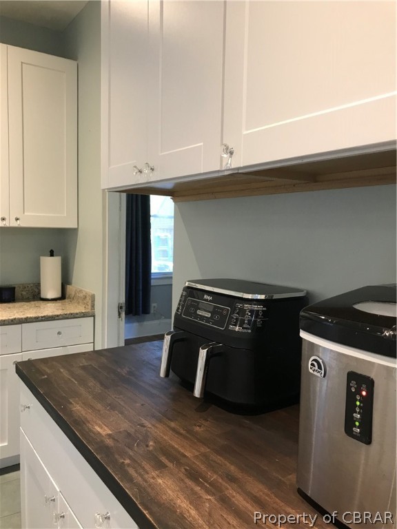 347 Lillys Neck Road Moon, VA 23119 - Photo 13 of 45 Kitchen with white cabinets, dark hardwood / wood-style flooring, and butcher block counters