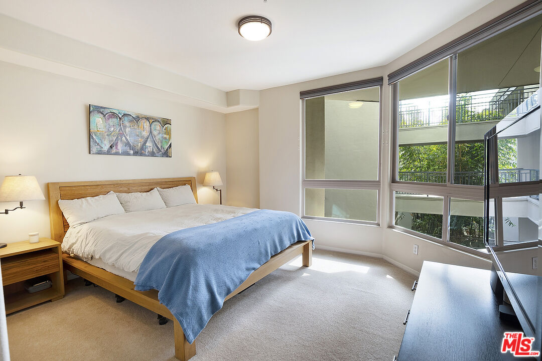 13044 Pacific Promenade, Unit 419 Playa Vista, CA 90094 - Photo 11 of 19 a bedroom with a large bed and a large window