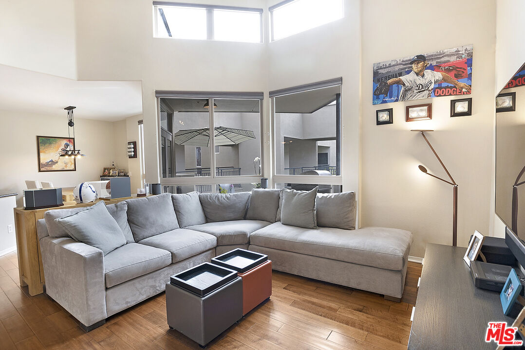 13044 Pacific Promenade, Unit 419 Playa Vista, CA 90094 - Photo 3 of 19 a living room with furniture and a flat screen tv