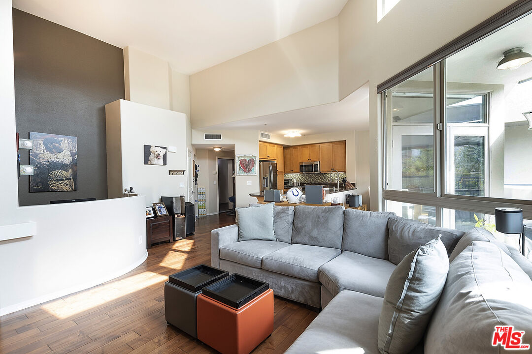 13044 Pacific Promenade, Unit 419 Playa Vista, CA 90094 - Photo 4 of 19 a living room with furniture and a couch