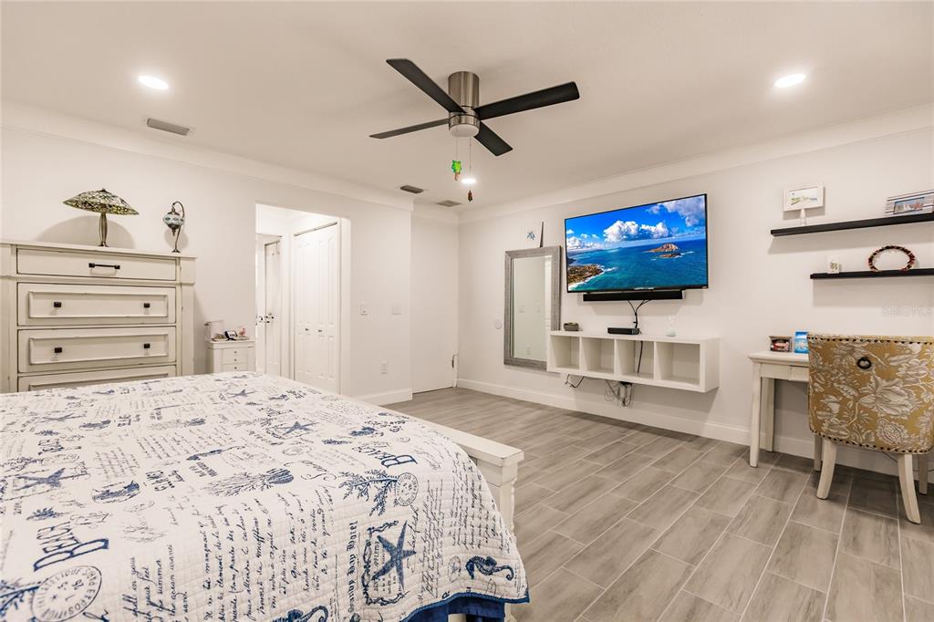 301 Gold Tree Punta Gorda, FL 33955 - Photo 22 of 60 a bedroom with furniture and a flat screen tv