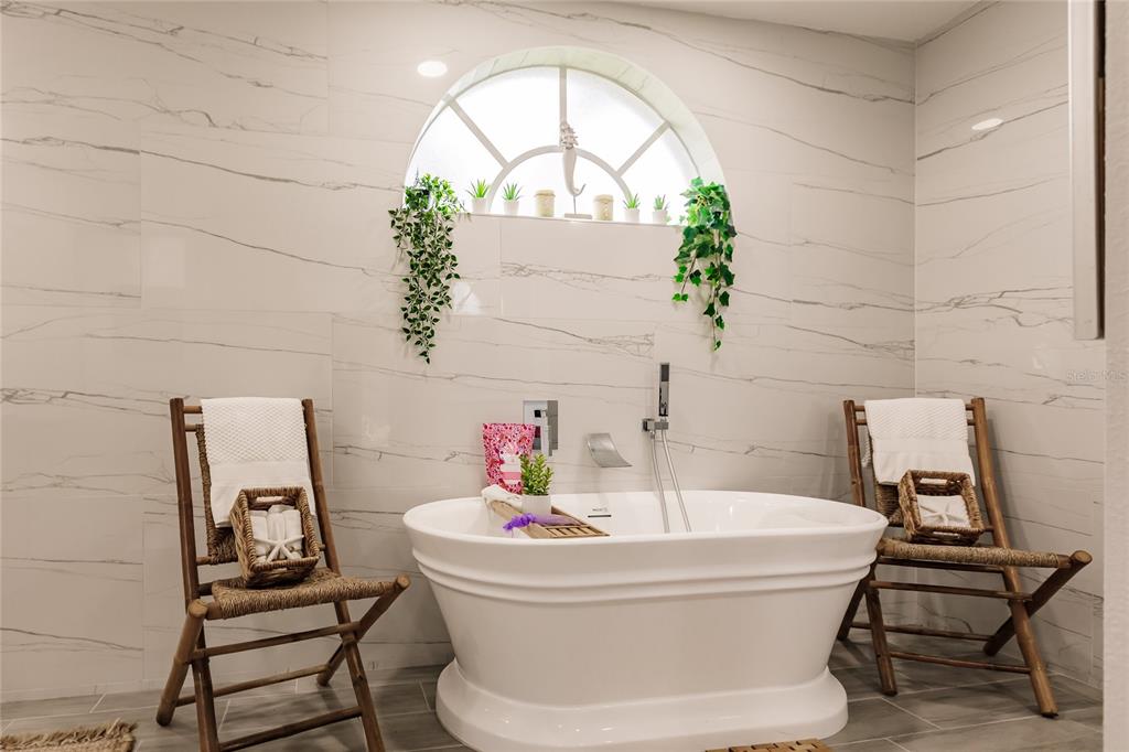 301 Gold Tree Punta Gorda, FL 33955 - Photo 24 of 60 a bathroom with a sink and a mirror