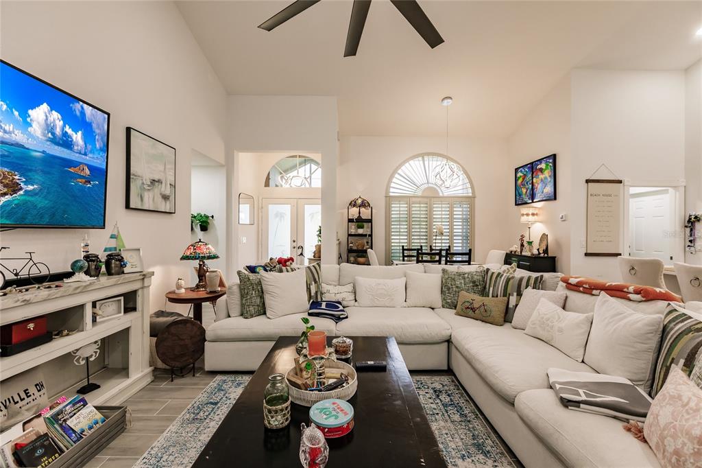 301 Gold Tree Punta Gorda, FL 33955 - Photo 6 of 60 a living room with furniture and a flat screen tv