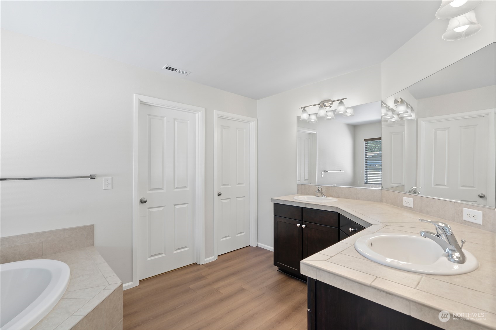 7004 Raptor Avenue Northeast Olympia, WA 98516 - Photo 12 of 28 a spacious bathroom with a sink double vanity granite tub and shower