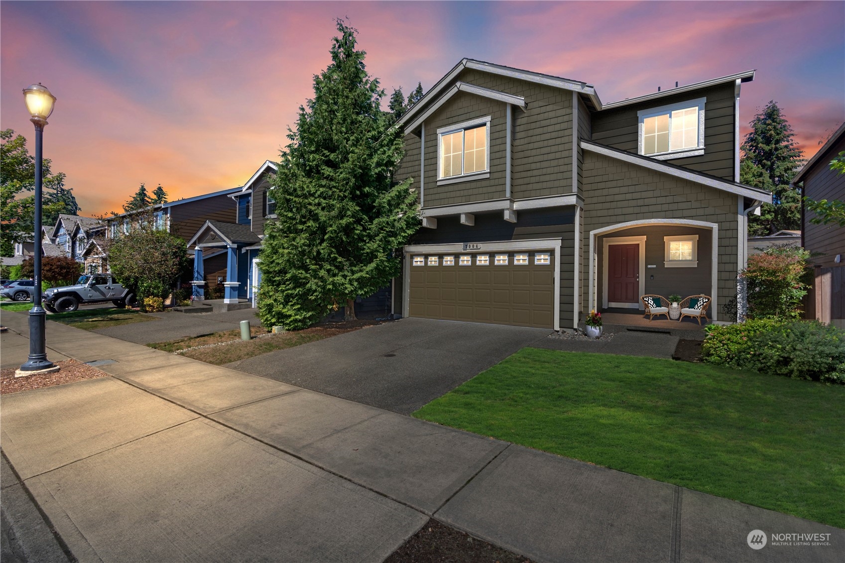 7004 Raptor Avenue Northeast Olympia, WA 98516 - Photo 27 of 28 a front view of a house with a yard and garage