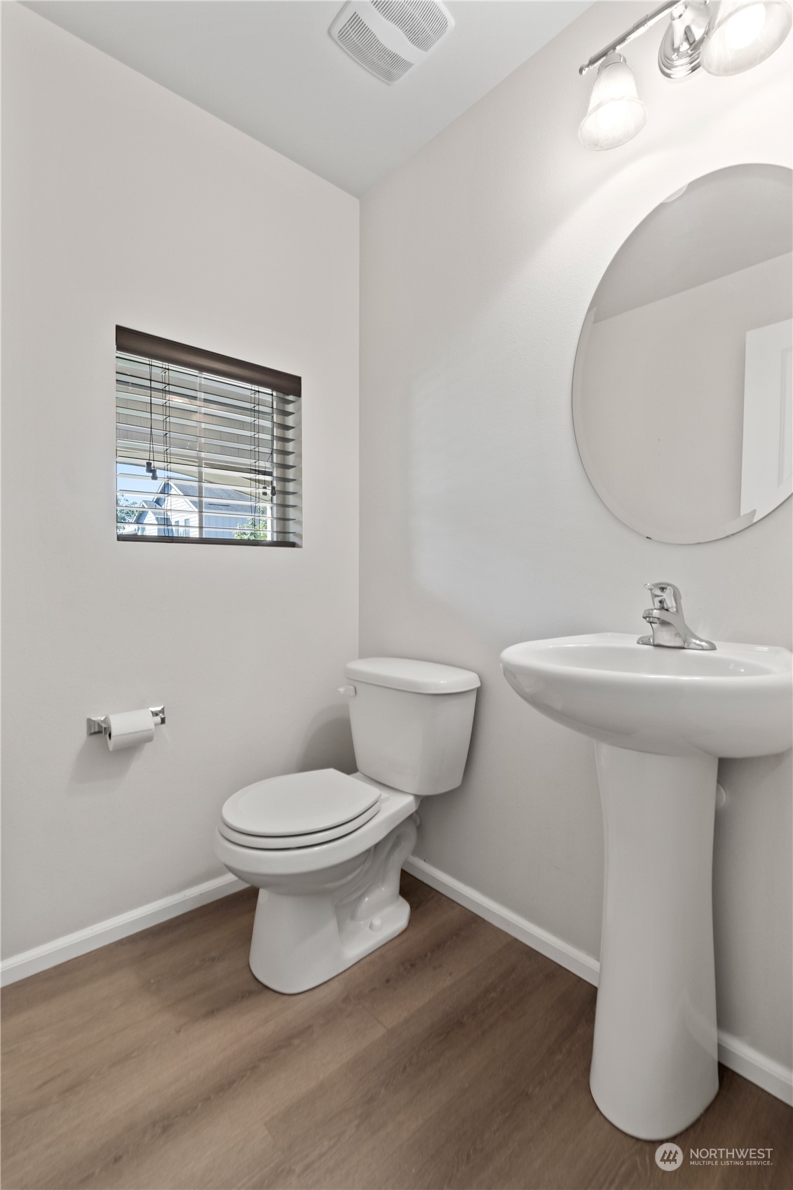7004 Raptor Avenue Northeast Olympia, WA 98516 - Photo 10 of 28 a bathroom with a sink toilet and a mirror