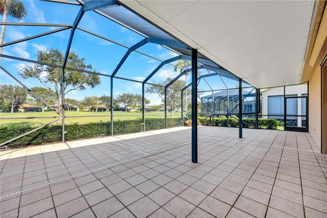 a view of a house with backyard and a patio