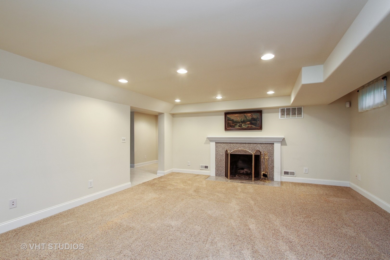 254 Spring Street Cary, IL 60013 - Photo 3 of 12 an empty room with furniture and fireplace