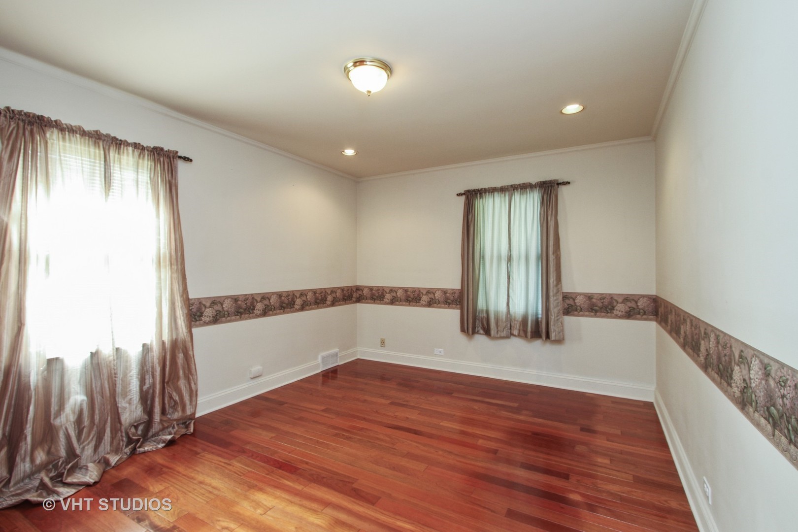 254 Spring Street Cary, IL 60013 - Photo 6 of 12 a view of empty room with wooden floor and fan
