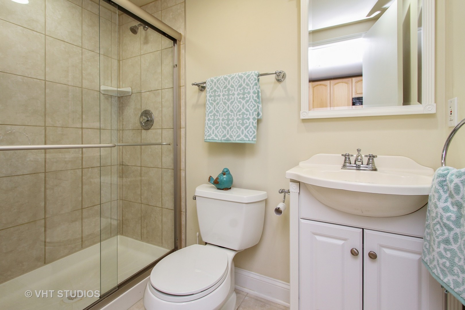 254 Spring Street Cary, IL 60013 - Photo 8 of 12 a bathroom with a sink mirror toilet and shower