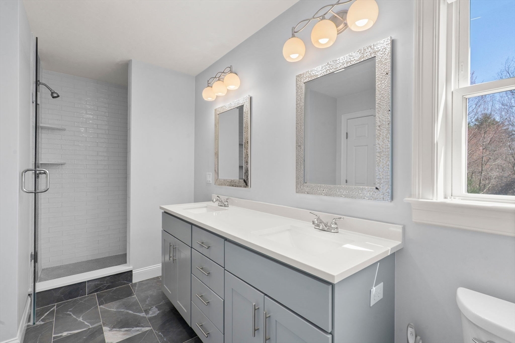 5 Glebe Street Rehoboth, MA 02769 - Photo 18 of 42 a bathroom with a sink and a mirror
