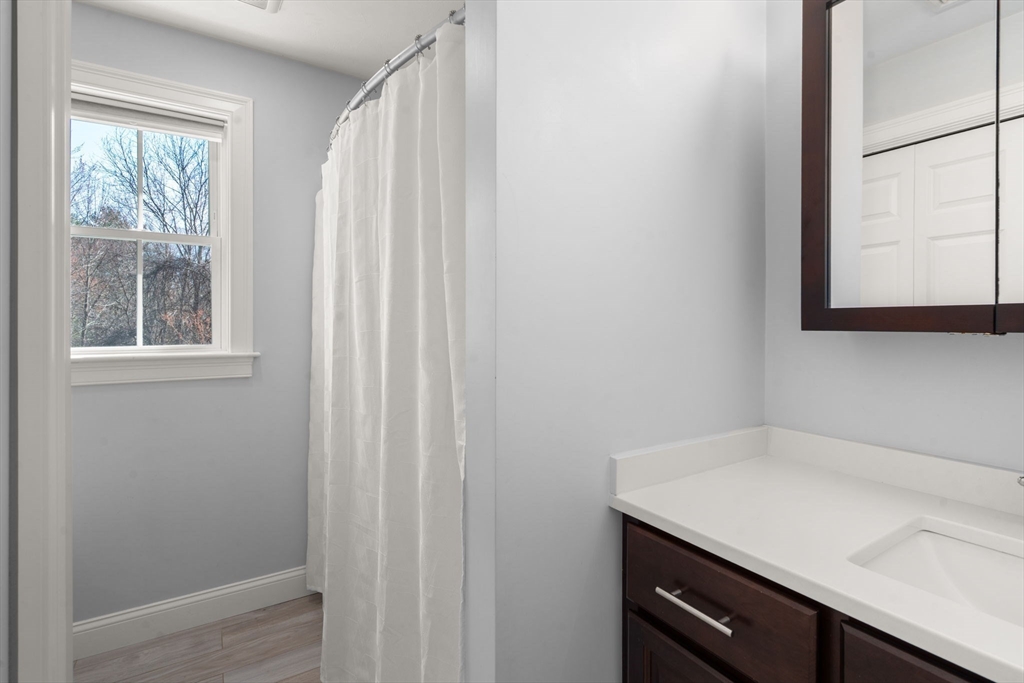 5 Glebe Street Rehoboth, MA 02769 - Photo 19 of 42 a room with a window and a cabinet