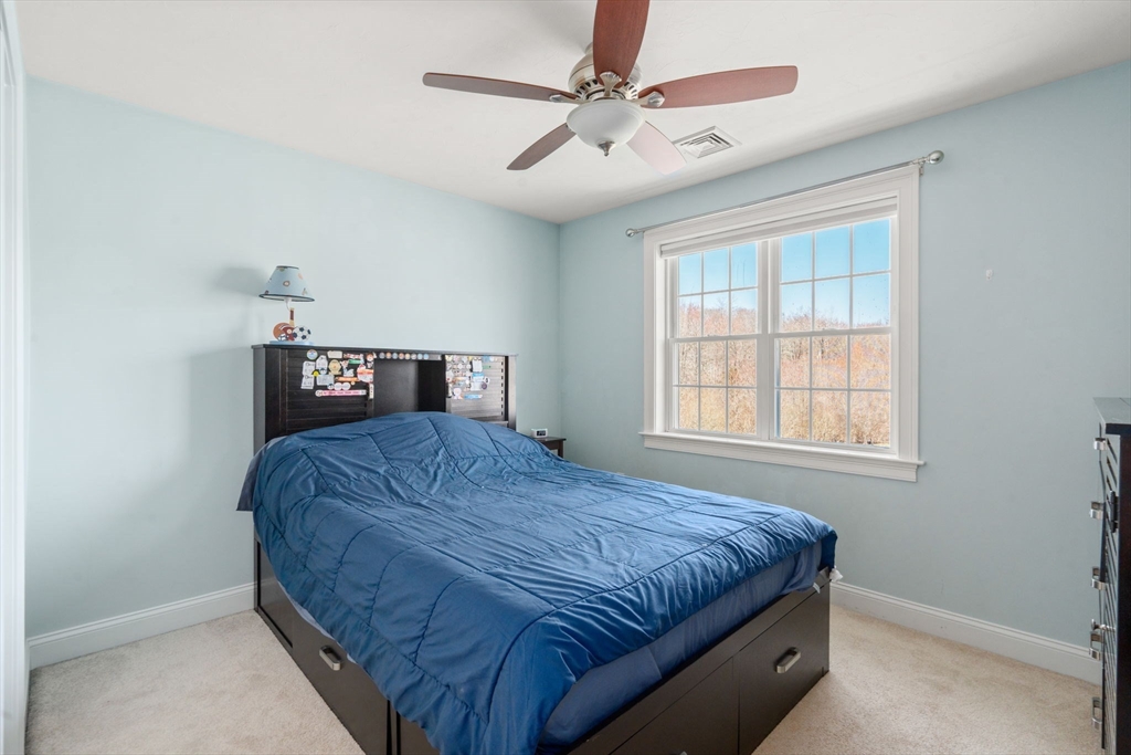 5 Glebe Street Rehoboth, MA 02769 - Photo 23 of 42 a bedroom with a bed and a table