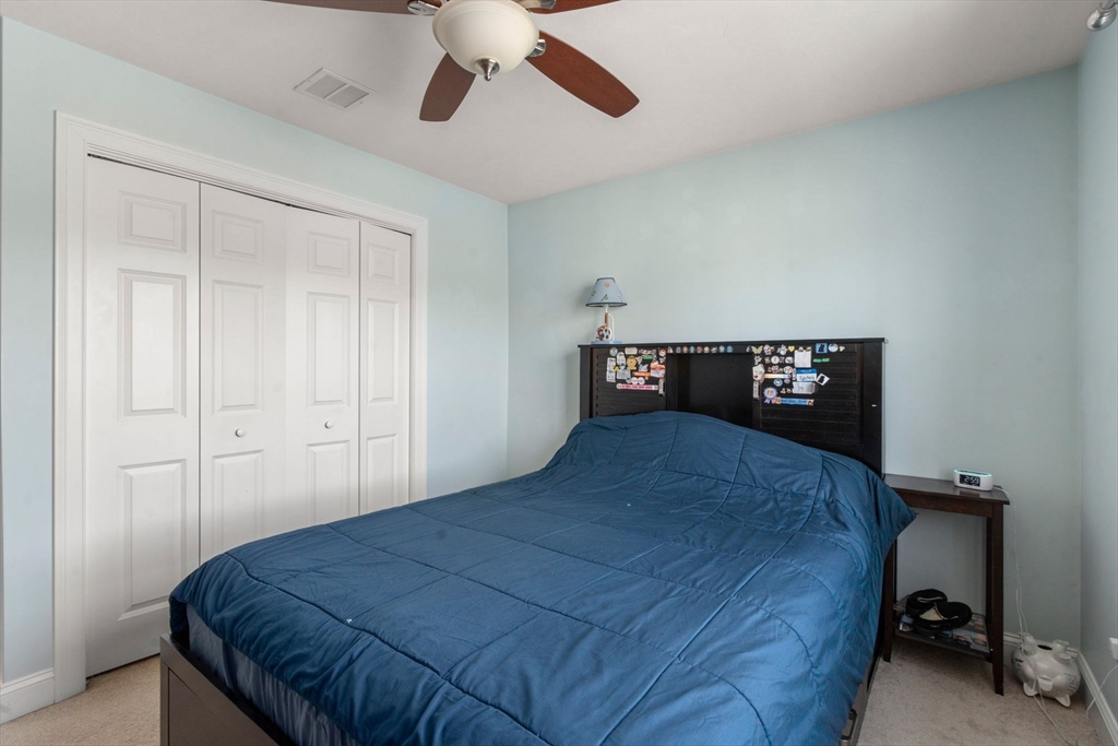 5 Glebe Street Rehoboth, MA 02769 - Photo 24 of 42 a bedroom with a bed and a table