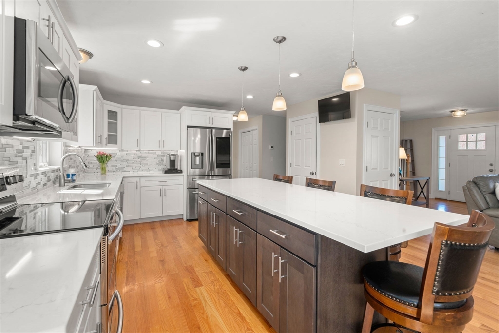5 Glebe Street Rehoboth, MA 02769 - Photo 5 of 42 a large kitchen with a large counter top appliances and cabinets