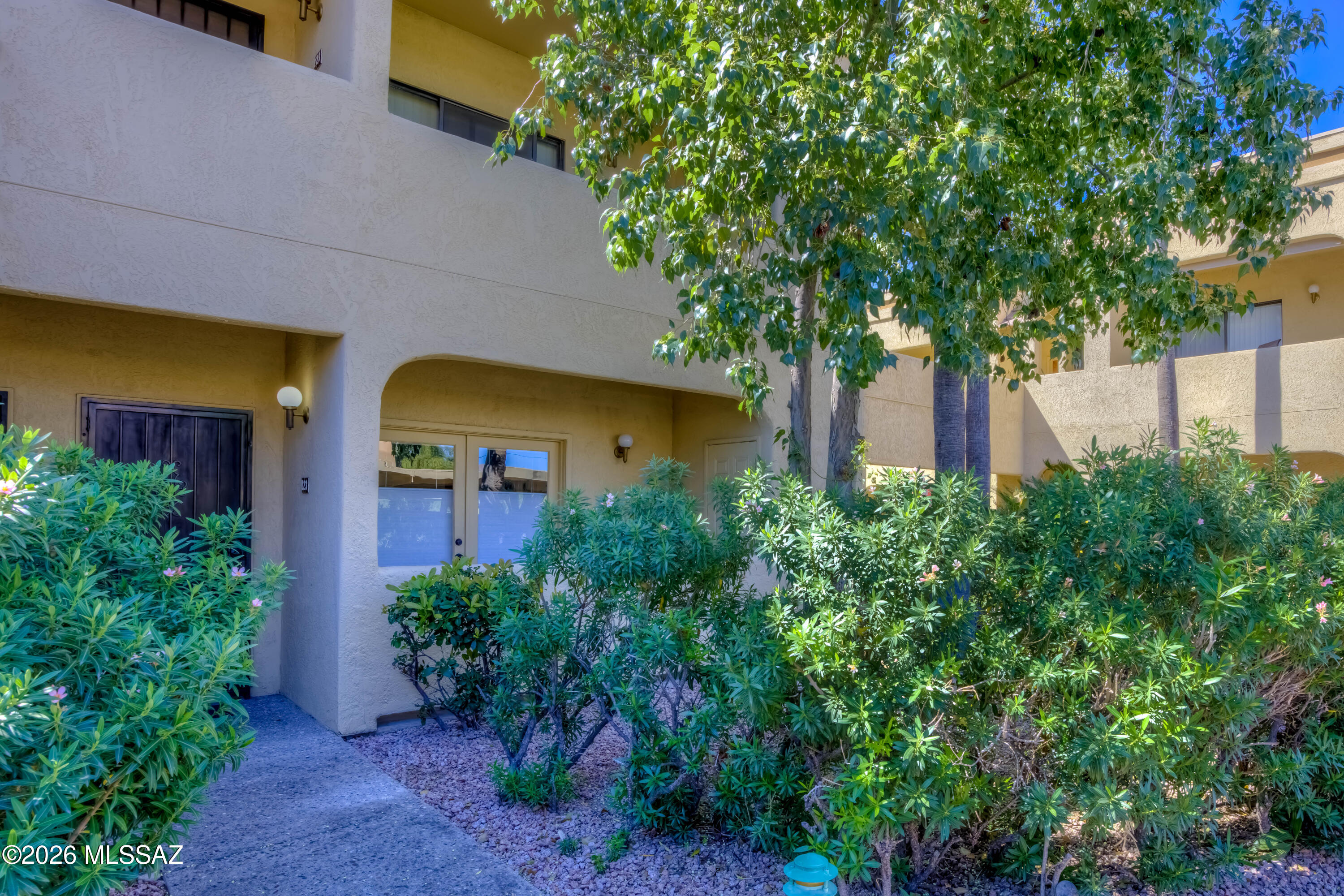 5500 North Valley View Road, Unit 123 Tucson, AZ 85718 - Photo 7 of 36 front view of a house with a tree