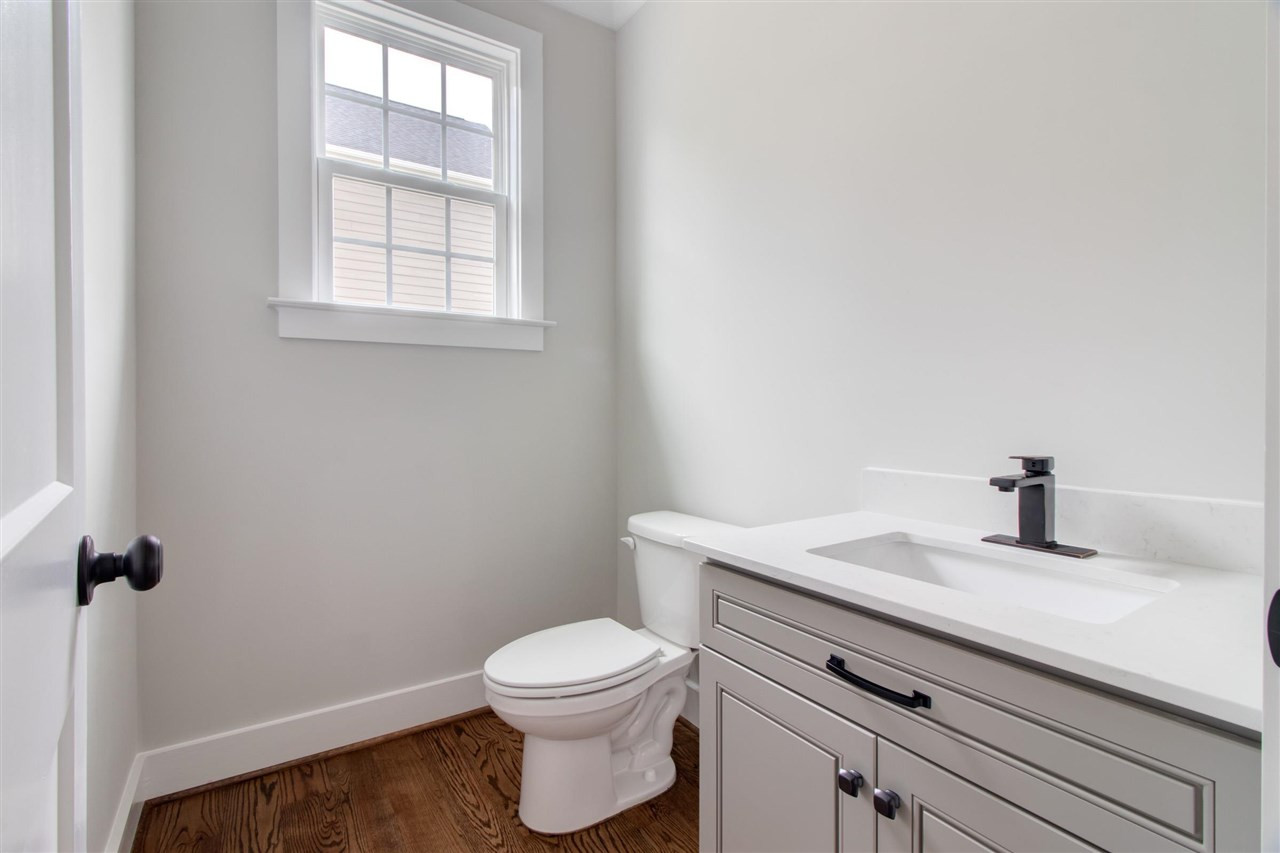2929 Chapel Hill Road Durham, NC 27707 - Photo 15 of 25 a bathroom with a granite countertop toilet and sink