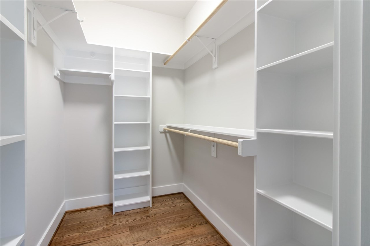 2929 Chapel Hill Road Durham, NC 27707 - Photo 17 of 25 a view of walk in closet with empty racks