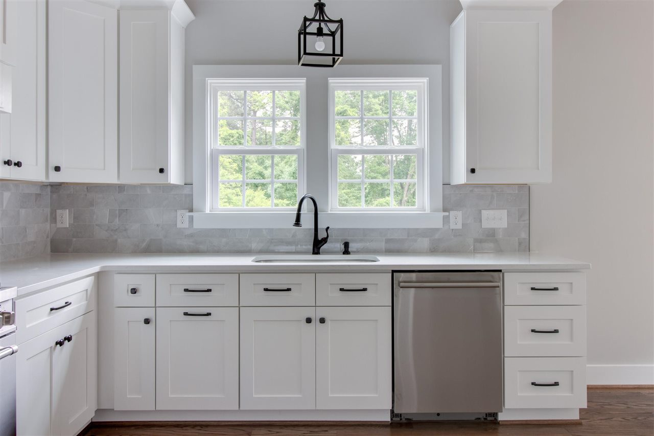 2929 Chapel Hill Road Durham, NC 27707 - Photo 10 of 25 a kitchen with white cabinets and sink