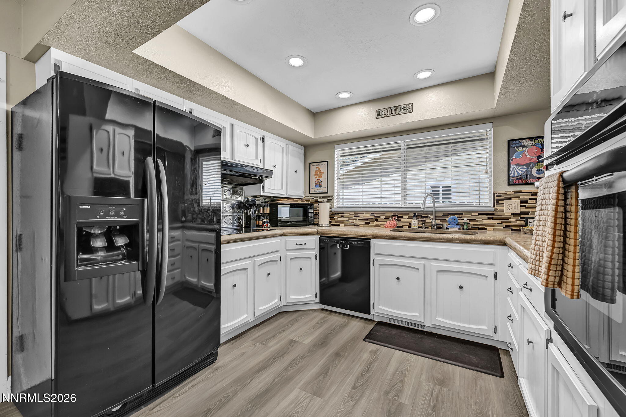 1490 Foster Drive Reno, NV 89509 - Photo 16 of 53 a kitchen with stainless steel appliances granite countertop a refrigerator and a stove top oven