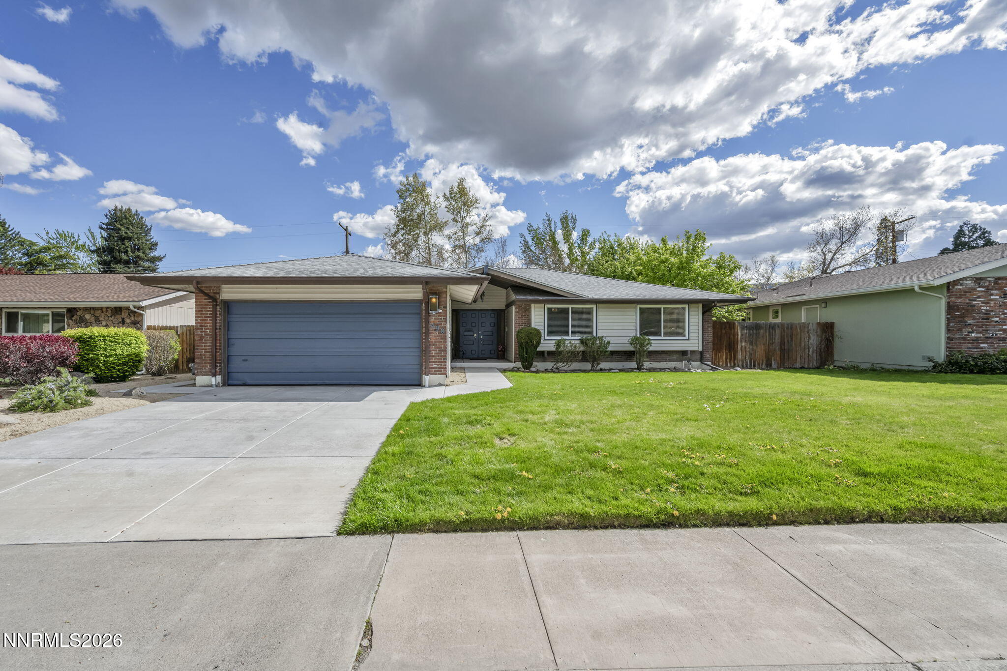 1490 Foster Drive Reno, NV 89509 - Photo 2 of 53 front view of a house with a yard