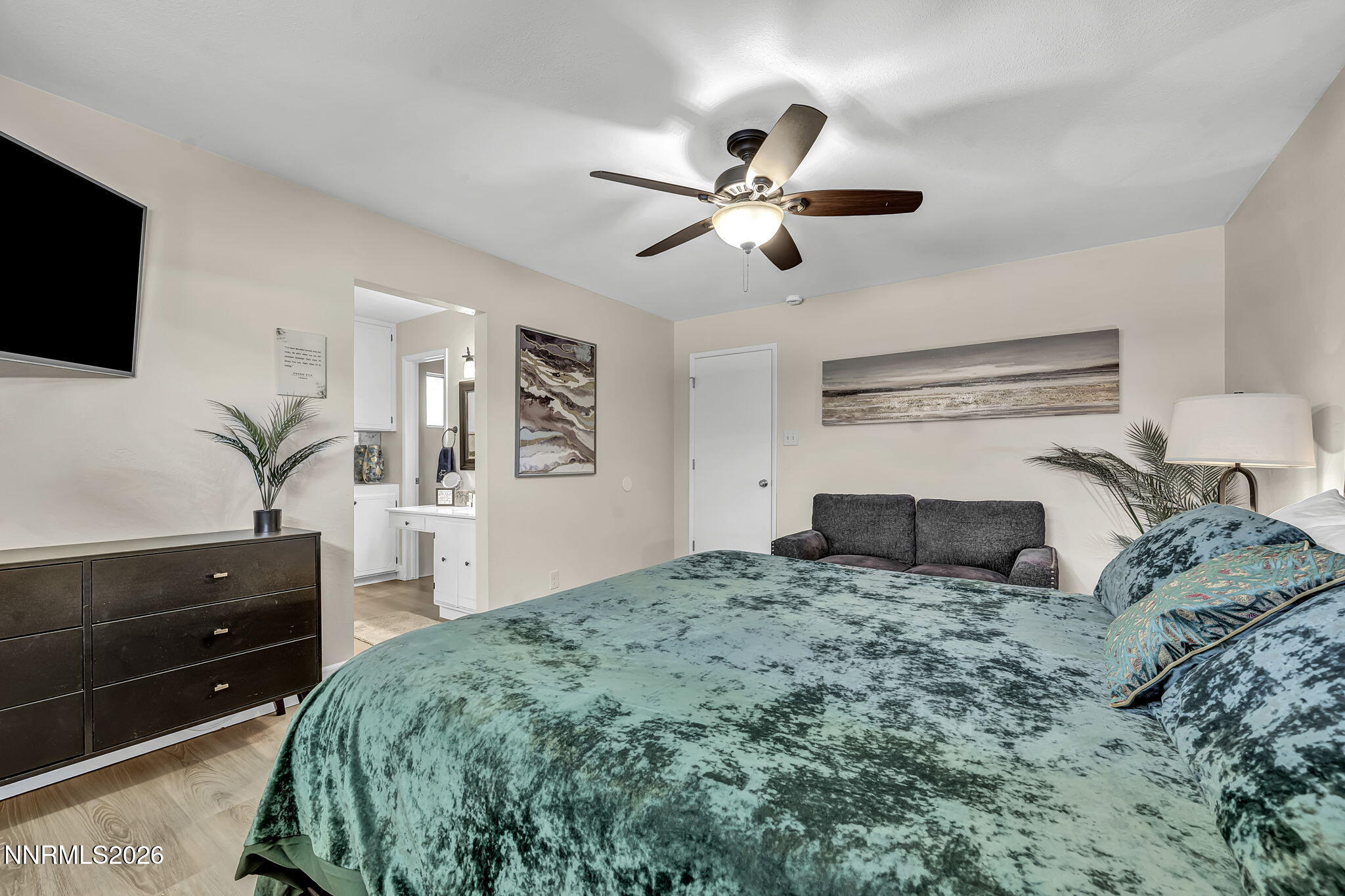 1490 Foster Drive Reno, NV 89509 - Photo 28 of 53 a bedroom with a bed and a flat screen tv
